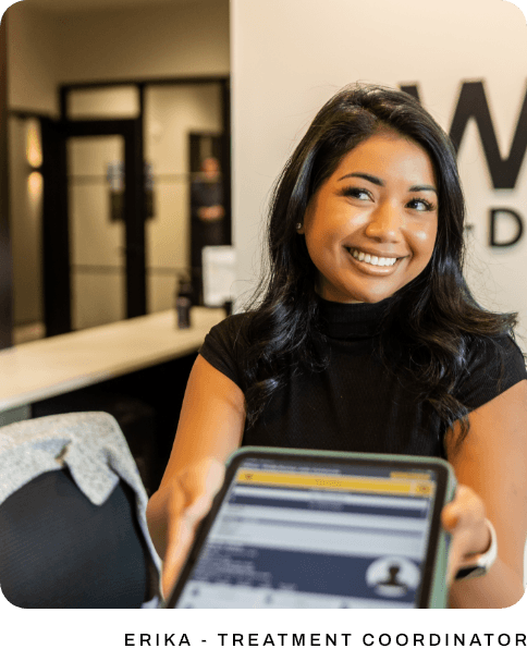 couple smiling together while looking at financial options in Portland